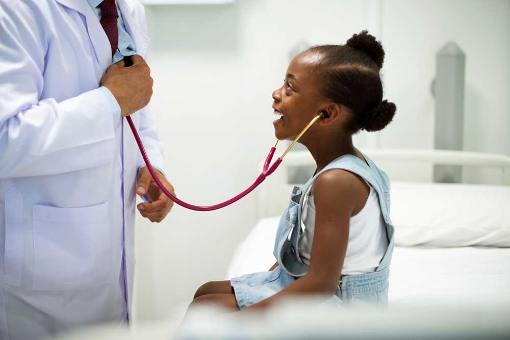 Pediatrician letting a child listen with a stethoscope | Pediatric Doctor in Warwick, NY | Warwick Pediatric & Women's Health
